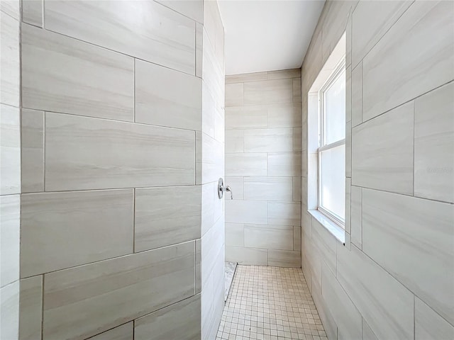 bathroom with tiled shower