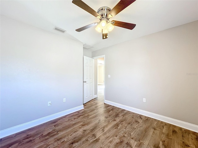 spare room featuring hardwood / wood-style flooring and ceiling fan