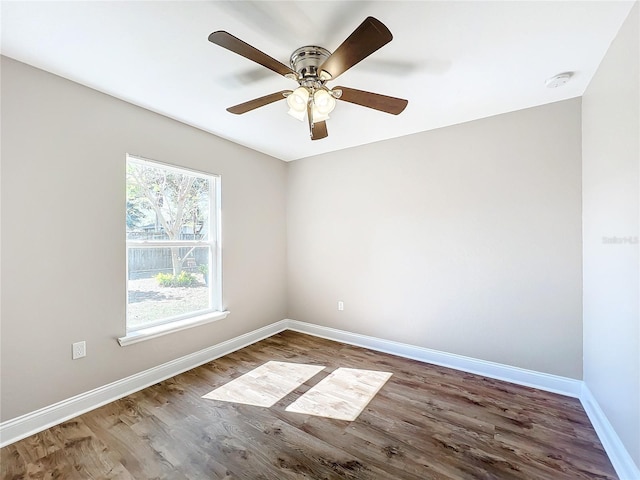 unfurnished room featuring hardwood / wood-style floors and ceiling fan