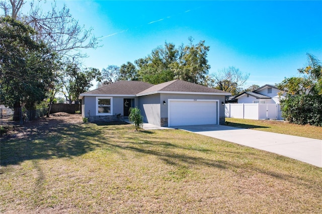 ranch-style home featuring a garage and a front lawn