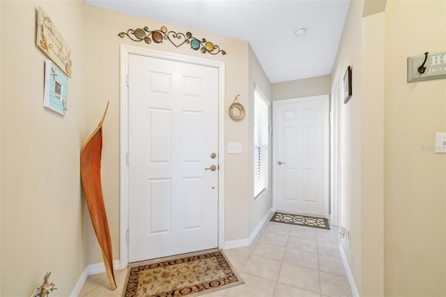 entrance foyer with light tile patterned floors