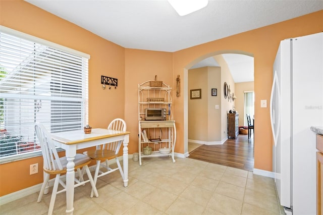 dining room featuring light tile patterned flooring