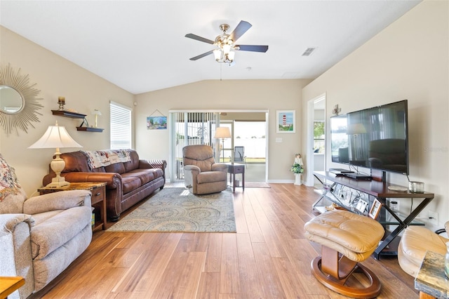 living room featuring vaulted ceiling, hardwood / wood-style floors, and ceiling fan