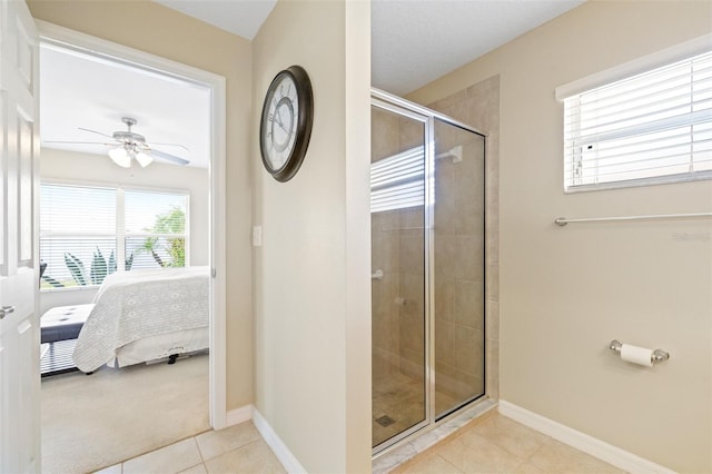 bathroom with an enclosed shower, tile patterned flooring, and ceiling fan