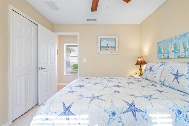 bedroom with ceiling fan and a closet