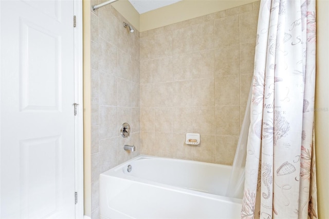 bathroom with shower / bathtub combination with curtain