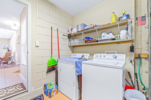 laundry room with washing machine and clothes dryer