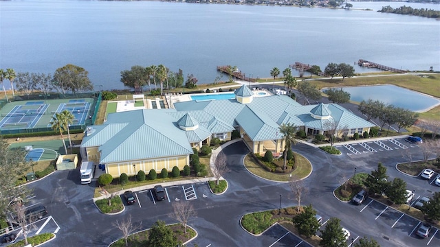 birds eye view of property with a water view