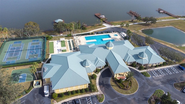 birds eye view of property with a water view