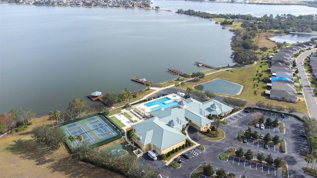 birds eye view of property with a water view