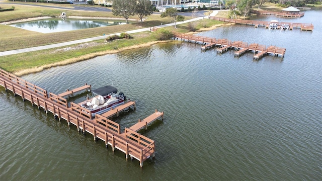 birds eye view of property featuring a water view