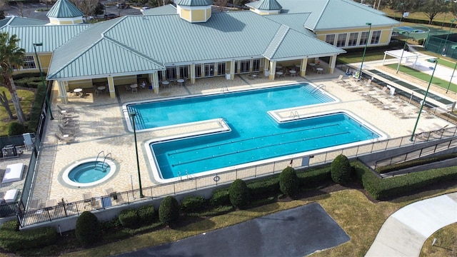 view of pool featuring a patio and a community hot tub