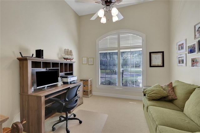 carpeted office featuring ceiling fan