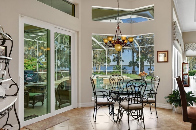 sunroom featuring an inviting chandelier