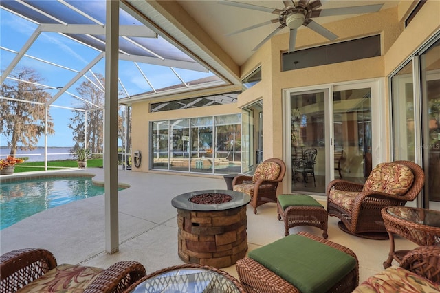 exterior space featuring a water view, ceiling fan, and lofted ceiling