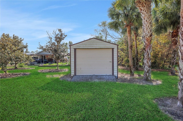 garage featuring a lawn