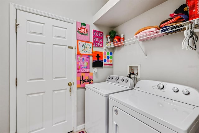 laundry room with washer and dryer