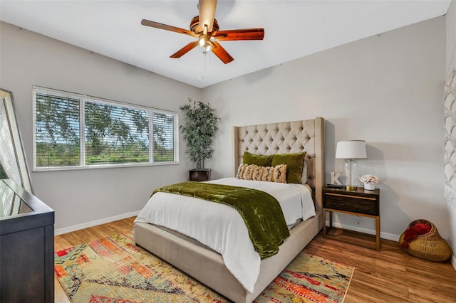 bedroom featuring hardwood / wood-style flooring and ceiling fan