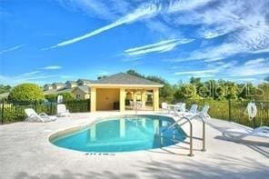 view of swimming pool with a patio