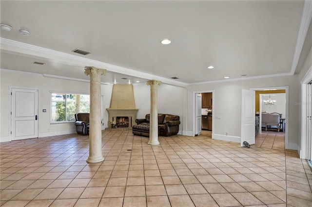 unfurnished living room featuring a large fireplace, ornamental molding, decorative columns, and light tile patterned floors