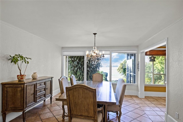 dining room with ornamental molding, light tile patterned floors, and a notable chandelier