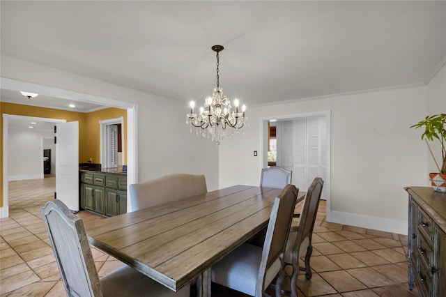 tiled dining space featuring ornamental molding