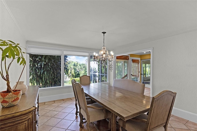 dining room featuring ornamental molding, light tile patterned floors, and a chandelier