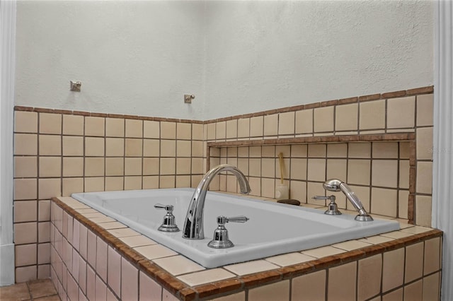 bathroom featuring tiled bath and tile walls