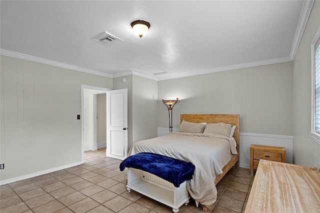 bedroom featuring crown molding and light tile patterned floors