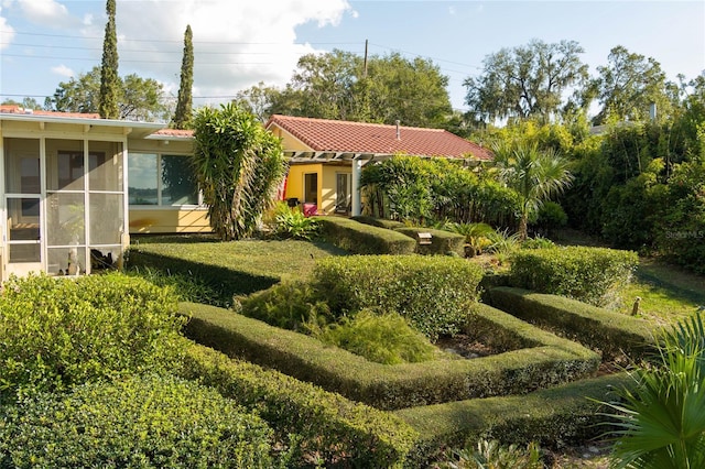 view of yard featuring a sunroom