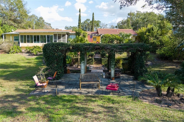 exterior space featuring a patio and a sunroom