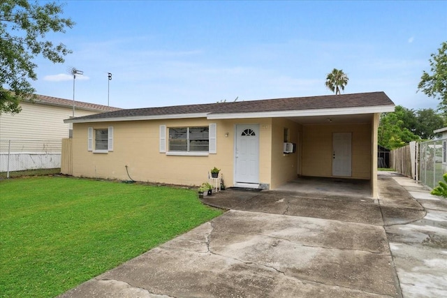 single story home with a front yard and a carport