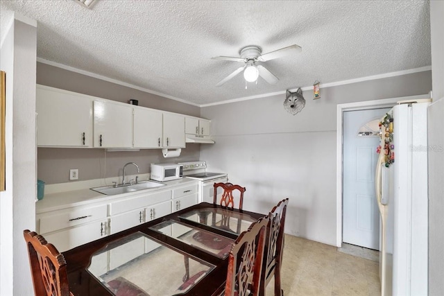 kitchen with crown molding, sink, white cabinets, and white appliances