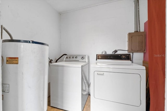 washroom featuring gas water heater and washing machine and clothes dryer