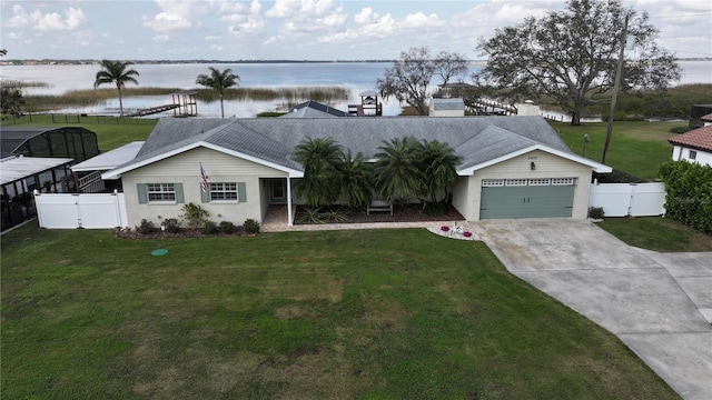 ranch-style home with a water view, a garage, and a front yard