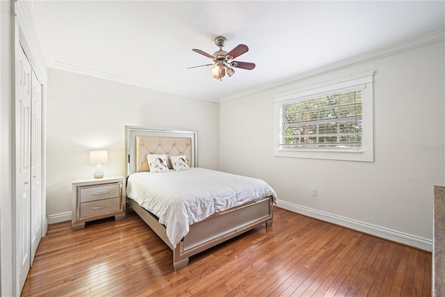 bedroom featuring crown molding, ceiling fan, and hardwood / wood-style flooring