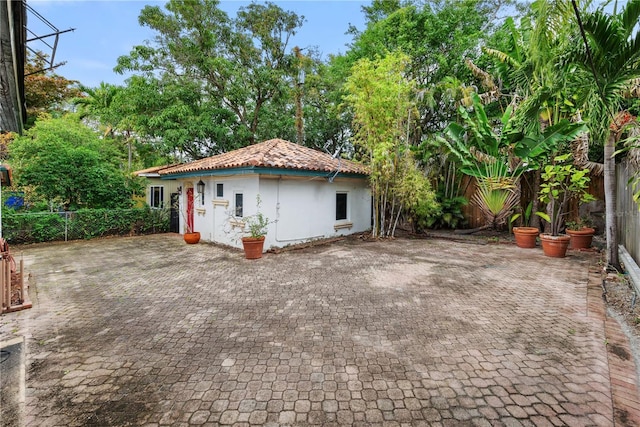 view of side of home with a patio area