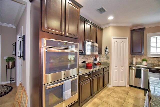 kitchen featuring crown molding, dark brown cabinets, and stainless steel appliances