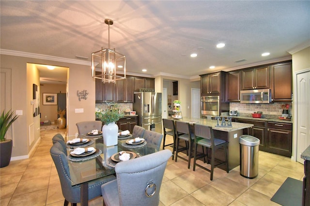 tiled dining room with crown molding