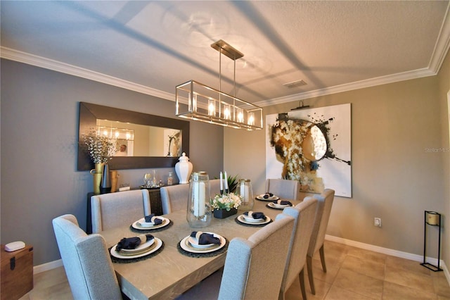 dining area featuring ornamental molding, a chandelier, a textured ceiling, and light tile patterned floors