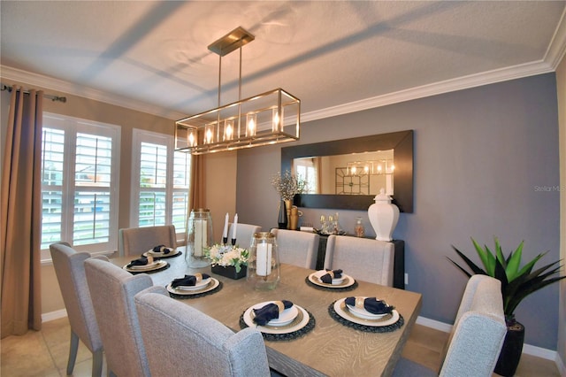 tiled dining room featuring ornamental molding and a chandelier