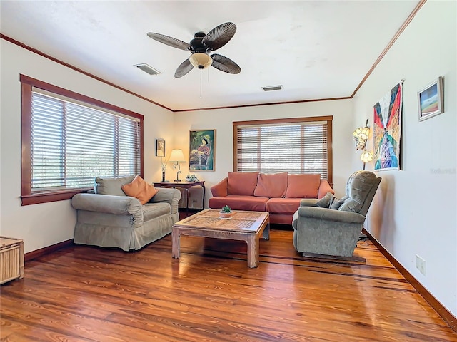 living room featuring crown molding, wood-type flooring, and ceiling fan