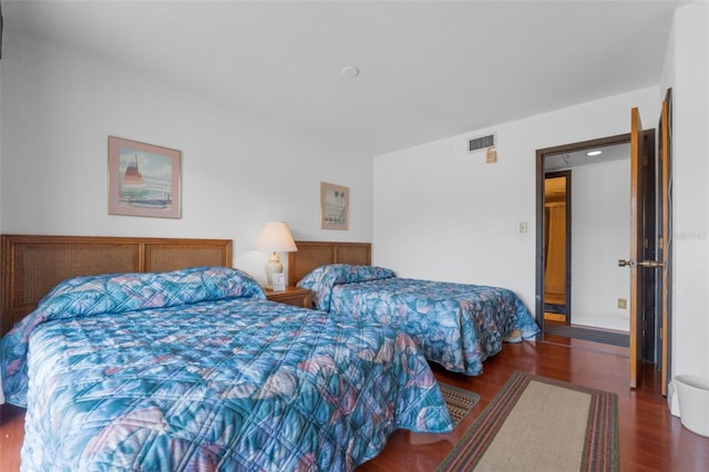 bedroom featuring dark hardwood / wood-style flooring