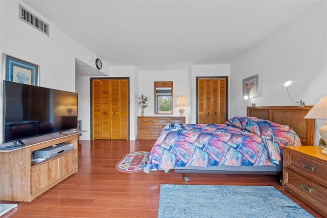 bedroom with wood-type flooring and a closet