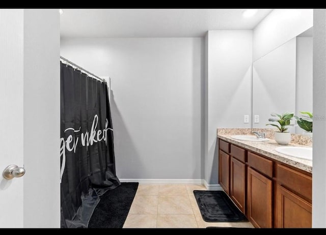 bathroom featuring tile patterned flooring and vanity