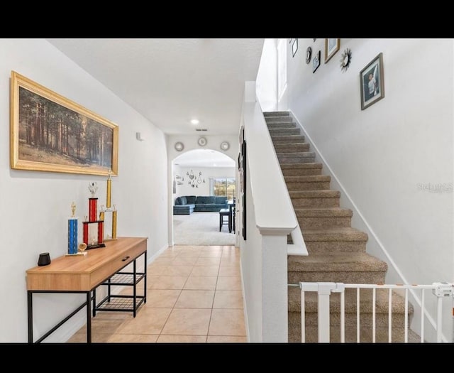 staircase with tile patterned floors