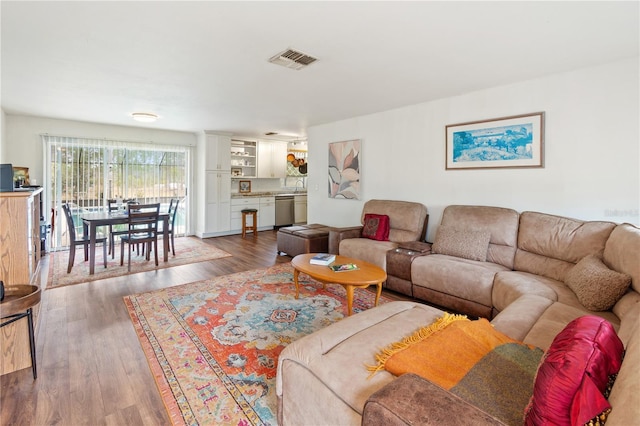 living room with dark hardwood / wood-style flooring