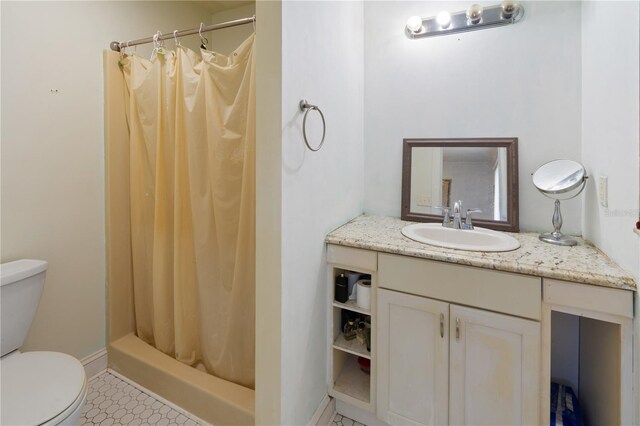 bathroom featuring vanity, a shower with curtain, and toilet