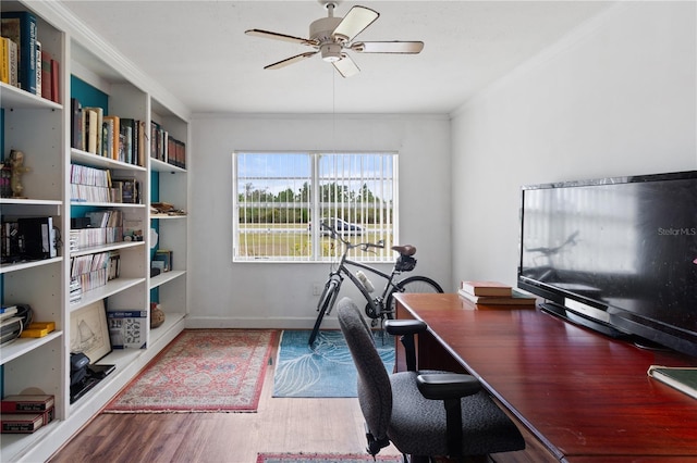 home office featuring hardwood / wood-style floors, crown molding, and ceiling fan