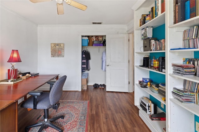 office featuring dark wood-type flooring, ornamental molding, and ceiling fan